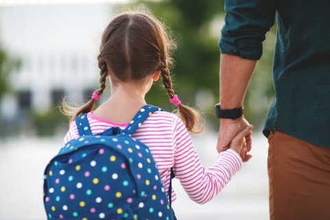 child holding hand on way to infant approval hearing